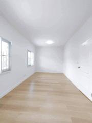 Spacious and Bright Empty Bedroom with Hardwood Floors