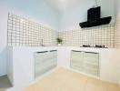 Modern kitchen with white cabinets and tiled backsplash