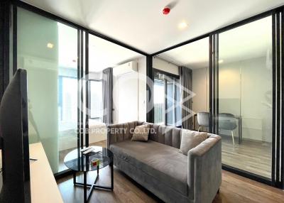 Modern living room interior with comfortable sofa and glass coffee table