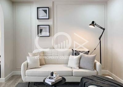 Contemporary living room with elegant sofa and tasteful wall art