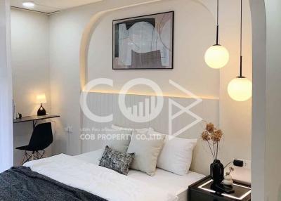 Modern bedroom with elegant decor and plush bedding