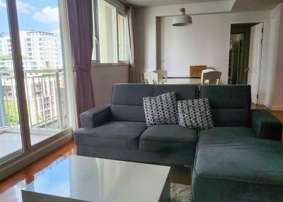 Modern living room with large windows and ample natural light