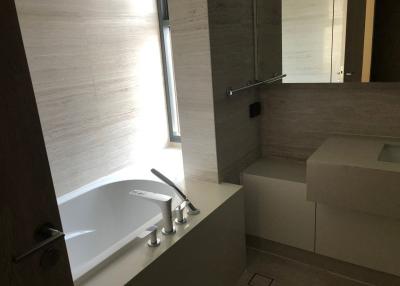 Modern bathroom with bathtub and neutral tones