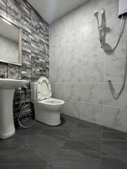 Modern bathroom with marble tiles and elegant fixtures