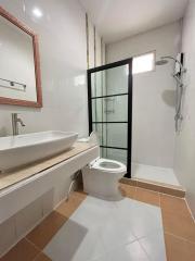 Modern bathroom with glass shower door and large sink