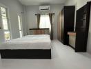 Modern bedroom with en-suite kitchenette
