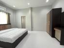 Modern bedroom with white bedding and minimalist decor