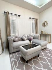 Elegant living room with modern furniture and tasteful decoration