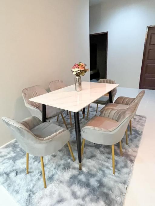 Modern dining room with stylish table and comfortable chairs