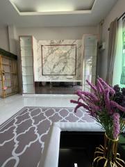 Elegant living room with marble fireplace and plush seating