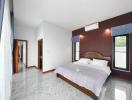 Spacious bedroom with polished marble floor and modern air conditioning