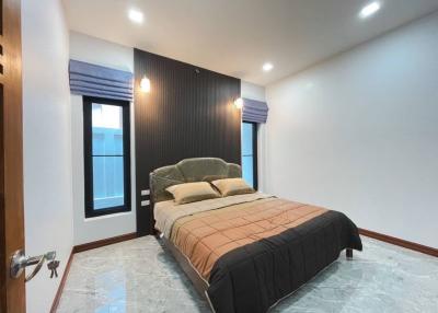 Spacious bedroom with modern design and large bed