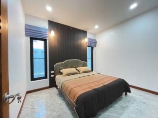 Spacious bedroom with modern design and large bed