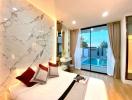 Elegant bedroom with marble wall and pool view