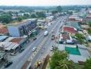 Aerial view of a bustling street with buildings and traffic