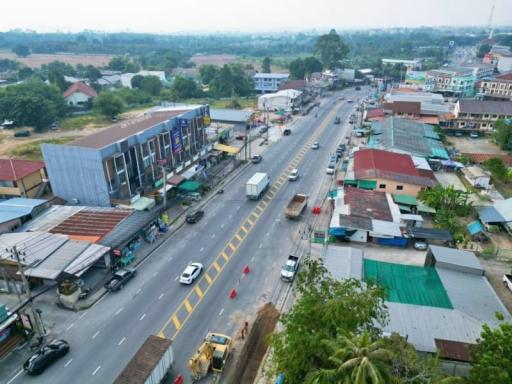 Aerial view of a bustling street with buildings and traffic