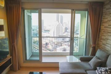 Modern living room with cityscape view through large windows