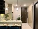 Modern kitchen with marble countertops and stylish pendant lights