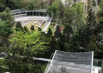 Scenic view from high-rise apartment showcasing lush greenery and outdoor communal area