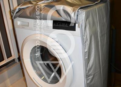 Modern front-loading washing machine in a laundry room