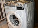 Modern front-loading washing machine in a laundry room