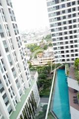 View of apartment buildings with a swimming pool