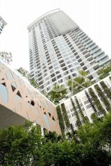 Modern high-rise residential building surrounded by greenery