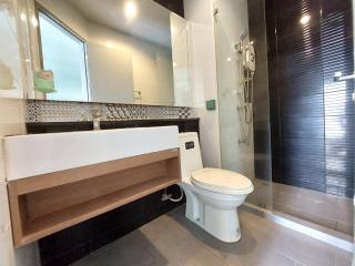 Modern bathroom with shower and stylish sink