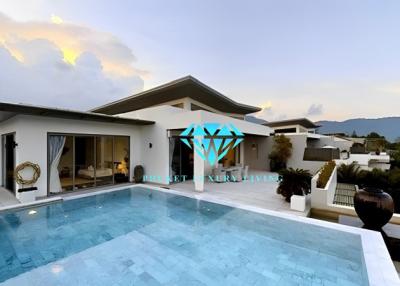 Luxurious home exterior with swimming pool at dusk