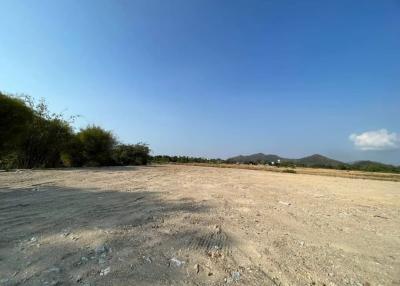 Spacious vacant land plot with clear skies and potential for development