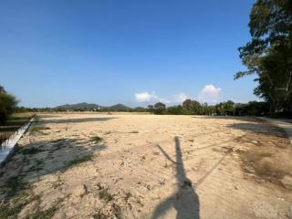 Spacious empty land with clear sky and natural surroundings