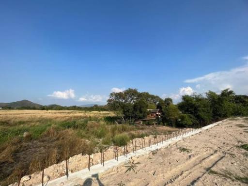 Rural landscape with open fields under blue sky