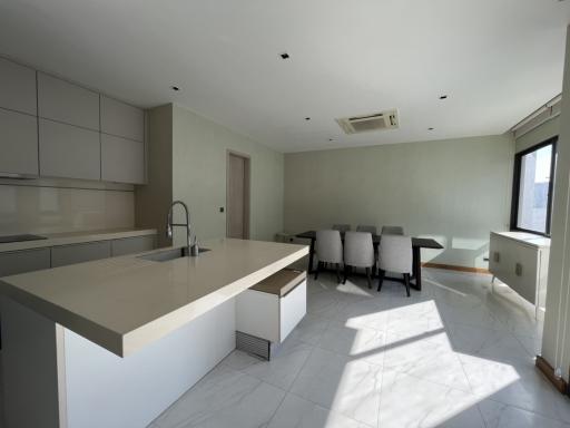 Modern kitchen with island and dining area