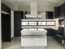 Modern kitchen with central island and built-in appliances