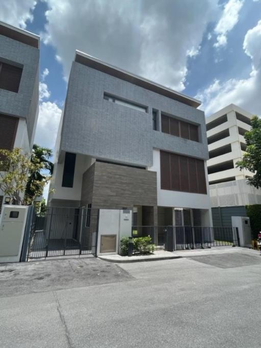 Modern two-story residential building with gray facade