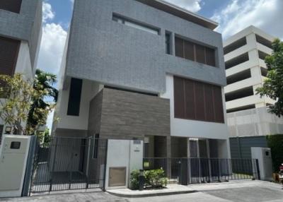 Modern two-story residential building with gray facade