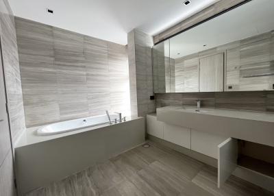 Modern spacious bathroom with bathtub and double sink
