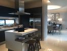 Modern kitchen with island and stainless steel appliances in a spacious home