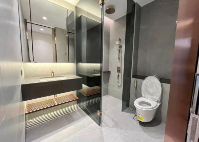 Modern bathroom with glass shower and stylish fixtures