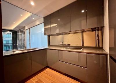 Modern kitchen with wooden floors and ample cabinet space