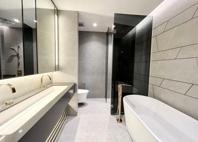 Modern bathroom with elegant fixtures and neutral tones