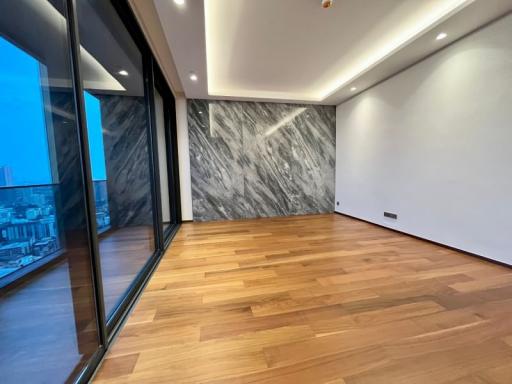 Modern apartment interior with large windows and hardwood flooring