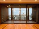 Spacious living room with large windows and city view