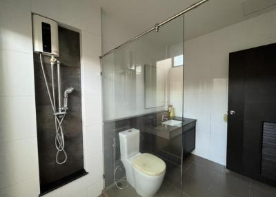 Modern spacious bathroom with a glass shower enclosure