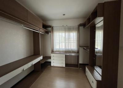 Spacious bedroom with built-in wardrobes and ample natural light