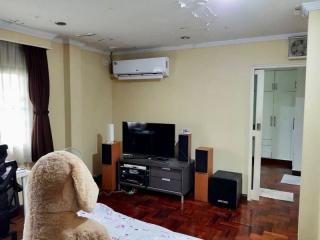 Cozy living room with entertainment system and polished wooden floor