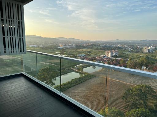 Spacious balcony with scenic view of the sunset over a rural landscape