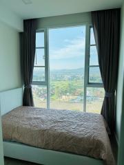 Cozy bedroom with a scenic view through large window