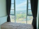 Cozy bedroom with a scenic view through large window