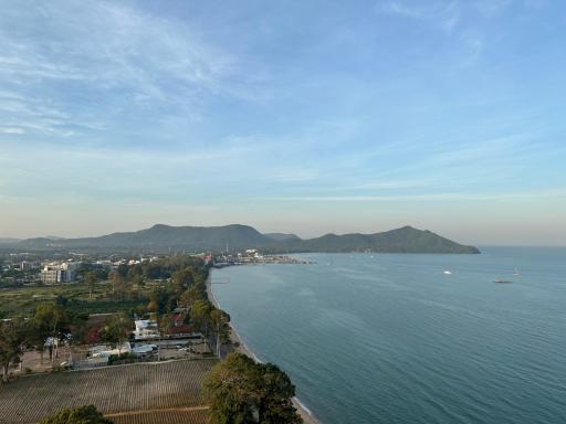 Panoramic view from property showing the coastal line, lush greenery and clear blue sky